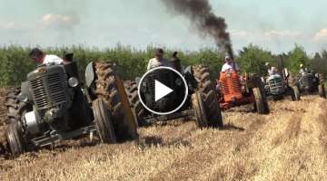 Old tractors plowing 