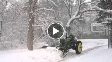 1950 John Deere MT plowing snow