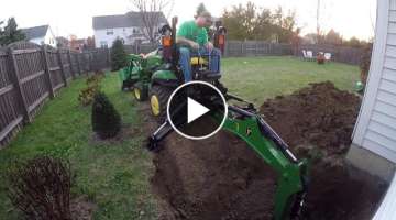 Compact Tractor Backhoe digs hole for basement egress window