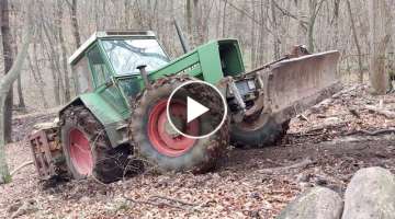 Fendt 612 hard climbing uphill in forest