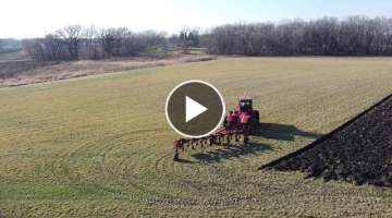 Neighbor plowing under a hay field with a 7 bottom plow
